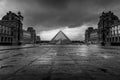 Louvre museum in black and white with reflection in a puddle. Louvre museum is one of the world`s largest museums with more than Royalty Free Stock Photo