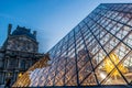 Pyramid`s at Louvre museum at dusk this is one of the most popular tourist destinations in France