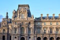Louvre Museum facade at sunset