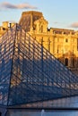 Louvre Museum facade at sunset