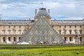 The Louvre Museum with the famous glass pyramid Royalty Free Stock Photo