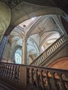 Louvre museum Palais architectural details of a hall with stone staircase, ornate railings and glowing vintage elements, Paris,