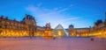 The Louvre Museum and Louvre Pyramid in Paris, France at sunrise Royalty Free Stock Photo