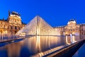 Louvre palace and pyramid at night, Paris, France Royalty Free Stock Photo