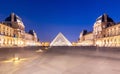 Louvre palace and pyramid at night, Paris, France Royalty Free Stock Photo