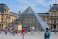 The Louvre Palace and the pyramid. Sightseeing tour around Paris. Royalty Free Stock Photo