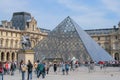 The Louvre Palace and the pyramid. Sightseeing tour around Paris. Royalty Free Stock Photo