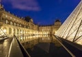 The Louvre Palace and the Pyramid which was completed in 1989, by night, Paris, France. Royalty Free Stock Photo