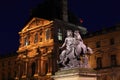 Louvre Palace and statue of Louis XIV, Paris Royalty Free Stock Photo