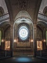 Louvre Palace symmetric architectural details of a hall with stone staircase, ornate railings, different corridors and am ornate