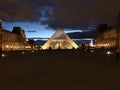 The Louvre in Paris France by night Royalty Free Stock Photo