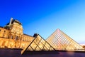 The Louvre Pyramid at dusk during the Michelangelo Pistoletto Ex