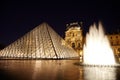Louvre Pyramid, fountain and Pavillon Rishelieu Royalty Free Stock Photo