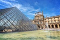 Louvre pyramid in the main courtyard of the Louvre Palace, Paris France