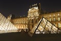 Louvre pyramid museum in Paris at night light, Musee du Louvre. Royalty Free Stock Photo