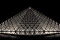 Louvre pyramid in Paris by night