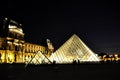 Louvre Pyramid in Paris, night with light