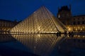 The Louvre pyramids at night