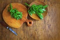 Lovage herb on cutting board. Woden background Royalty Free Stock Photo