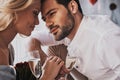 Love is in the air. Beautiful young couple drinking champagne an Royalty Free Stock Photo