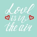 Love is in the air handwritten text. Calligraphic lettering, grunge style. Dark brush pen lettering isolated on white