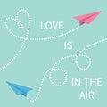 Love is in the air Lettering text. Two flying origami paper plane.