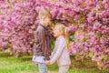 Love is in the air. Tender love feelings. Little girl and boy. Romantic date in park. Spring time to fall in love. Kids Royalty Free Stock Photo