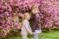 Love is in the air. Tender love feelings. Little girl and boy. Romantic date in park. Spring time to fall in love. Kids Royalty Free Stock Photo