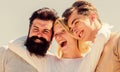 Love is in the air. time to relax. group of people outdoor. heaven concept. success heights. happy woman and two men Royalty Free Stock Photo