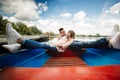 Love is all that matters. Top view of beautiful young couple taking selfie using smart phone while lying in the boat Royalty Free Stock Photo