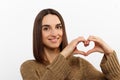 Love all you need. Charming romantic charismatic passionate girl brown eyes show heart gesture confessing sympathy look