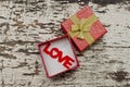 Love alphabet in gift box on grunge wood background Royalty Free Stock Photo