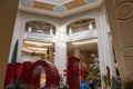 The Love Art Sculpture in the waterfall atrium at The Venetian Resort and Hotel with lush green trees and plants, colorful flowers Royalty Free Stock Photo