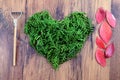 Love autumn decoration with twigs forming a heart on wooden back