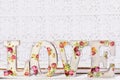 love background with decoupage decorated letters with rose pattern Royalty Free Stock Photo