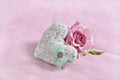 Love background with knitted heart and rose