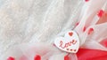Love background for Valentine Day. Cozy design with cookie and fabric. Flat lay. Top view Royalty Free Stock Photo