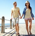 Love, beach and couple holding hands, happy and relax while walking, travel and fun on seaside vacation. Sea, holiday Royalty Free Stock Photo