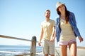 Love, beach and portrait of couple holding hands at the beach for travel, fun and summer vacation. Sea, holiday and Royalty Free Stock Photo