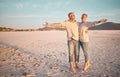 Love, beach and summer with a senior couple standing together on the sand on a sunny day. Travel, vacation and romance Royalty Free Stock Photo