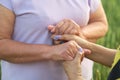 Love Beyond Time: This poignant image of two elderly women sharing a heartfelt moment hand-in-hand speaks volumes about Royalty Free Stock Photo