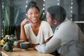 Love, black couple and talking at cafe with coffee on romantic date. Coffee shop, communication and romance of man and Royalty Free Stock Photo