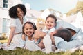 Love, blended family and parents on the lawn with their children in the garden of their home together. Mother, father Royalty Free Stock Photo