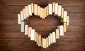 Love of books reading. Stack of books in the colored cover lay on the table in the shape of a heart. Library, education. Empty