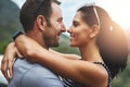 Love can be a simple smile. a young couple in a loving embrace outdoors. Royalty Free Stock Photo