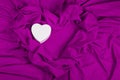 Love card with heart on a purple fabric Royalty Free Stock Photo