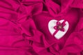 Love card with heart on a purple fabric Royalty Free Stock Photo
