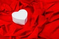 Love card with heart on a red fabric Royalty Free Stock Photo