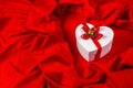 Love card with heart on a red fabric Royalty Free Stock Photo