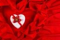 Love card with heart on a red fabric Royalty Free Stock Photo